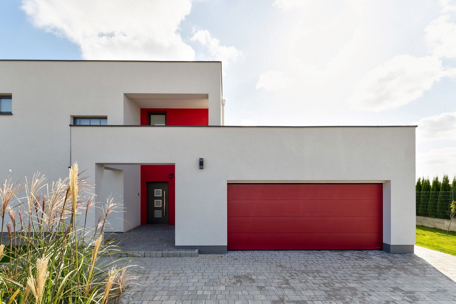 PRIME garage door in the HI FLAME RED colour; CREO 336 door